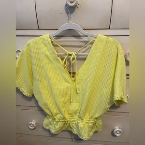 Framcesca’s boutique yellow blouse with cloth buttons and string ties!